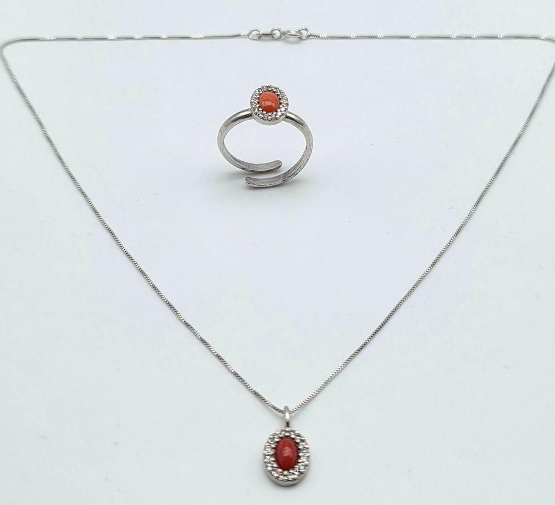 925 silver necklace and ring with red coral (corallium rubrum) and zirconia: Title:925 silver necklace and ring with red coral (corallium rubrum) and zirconiaDescription:925 silver necklace and ring with red coral (corallium rubrum) and zirconia handcrafted in torre del