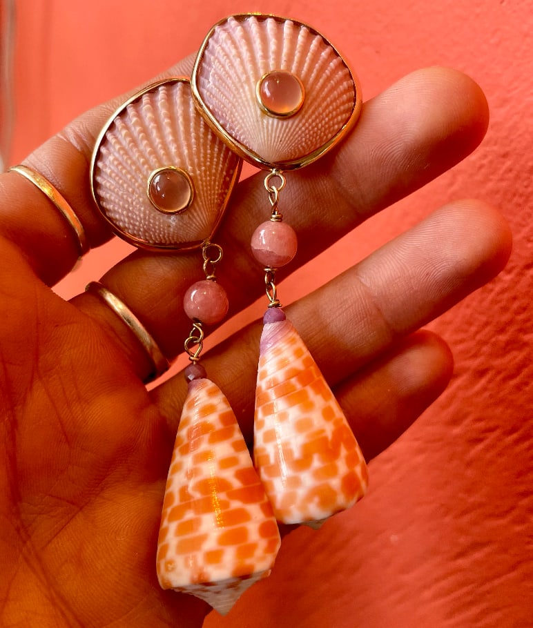 Pink Scallop Earrings: Title:Pink Scallop Earrings Description:Pink Scallop and Conus shell earrings in 14-K Gold Reserve: $1,680.00 Shipping: Domestic: Shipping rates are determined by destination International: Foreign sh