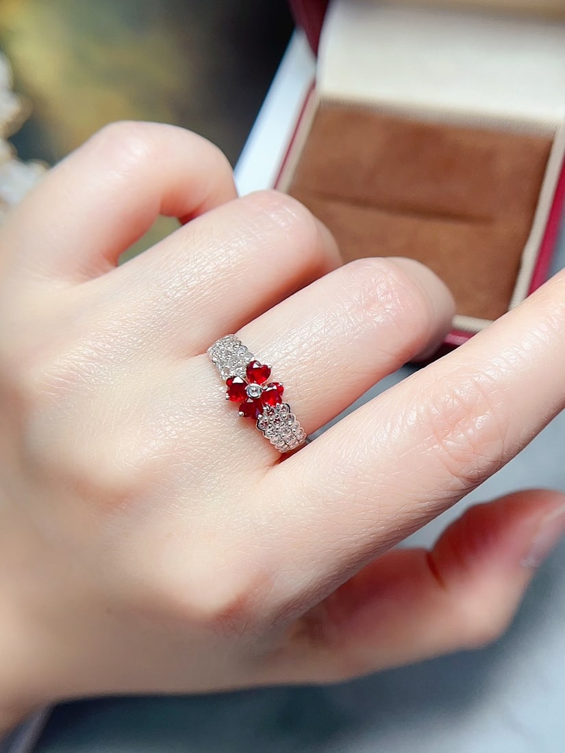 18K Gold Ruby Ring: Title: 18K Gold Ruby Ring Description: This ring features a stunning natural ruby at its center, crafted with precision in 18K gold, with a four-leaf clover design symbolizing beauty and elegance.