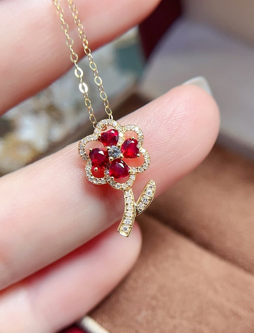 18K gold natural ruby pendant: Title: 18K gold natural ruby pendant Description: This pendant features a striking heart-shaped natural ruby as the main stone, set in an elegant floral design showcasing exceptional craftsmanship