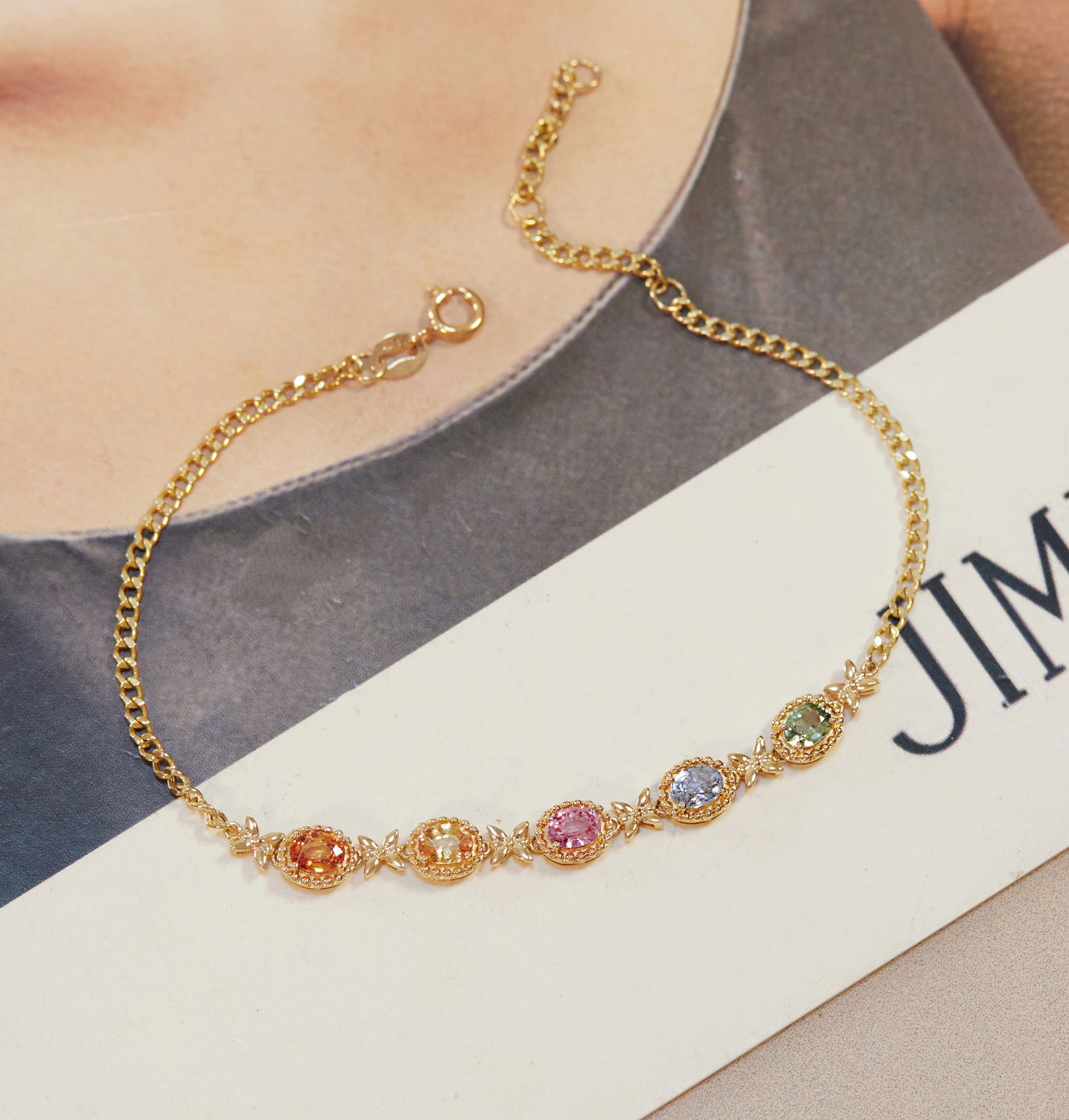 18k gold colored gemstone bracelet: Title: 18k gold colored gemstone bracelet Description: 18k gold colored gemstone bracelet, like seeing a beautiful rainbow in the sky, with butterflies dancing nearby. Reserve: $1,200.00 