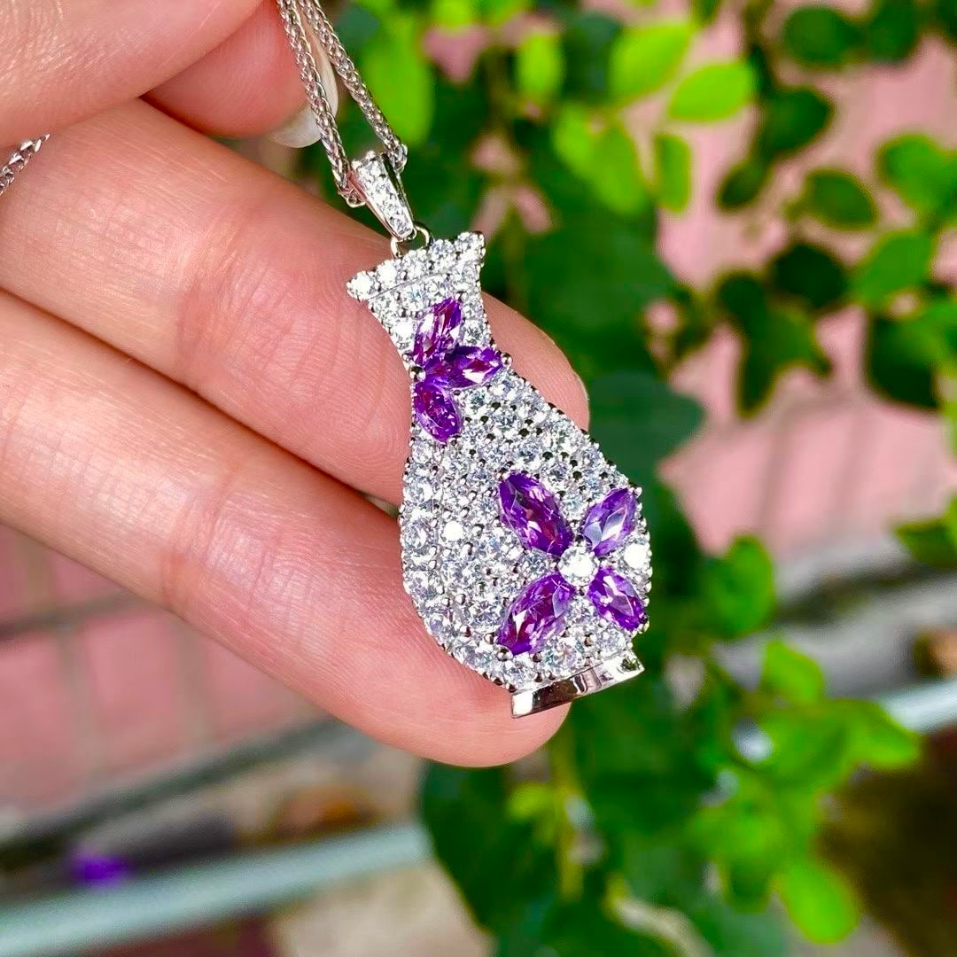925 silver natural amethyst pendant: Title: 925 silver natural amethyst pendant Description: This 925 silver pendant showcases eternal charm with its dazzling natural amethyst center. The exquisite craftsmanship of the pendant is
