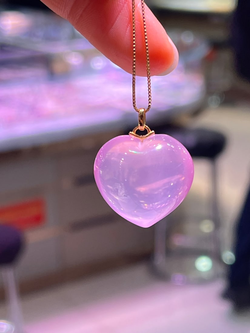 Sterling Silver Natural Crystal Heart Pendant: Title: Sterling Silver Natural Crystal Heart Pendant Description: This pendant showcases a beautiful heart carved from natural pink crystal, renowned for its charming color and flawless crystal