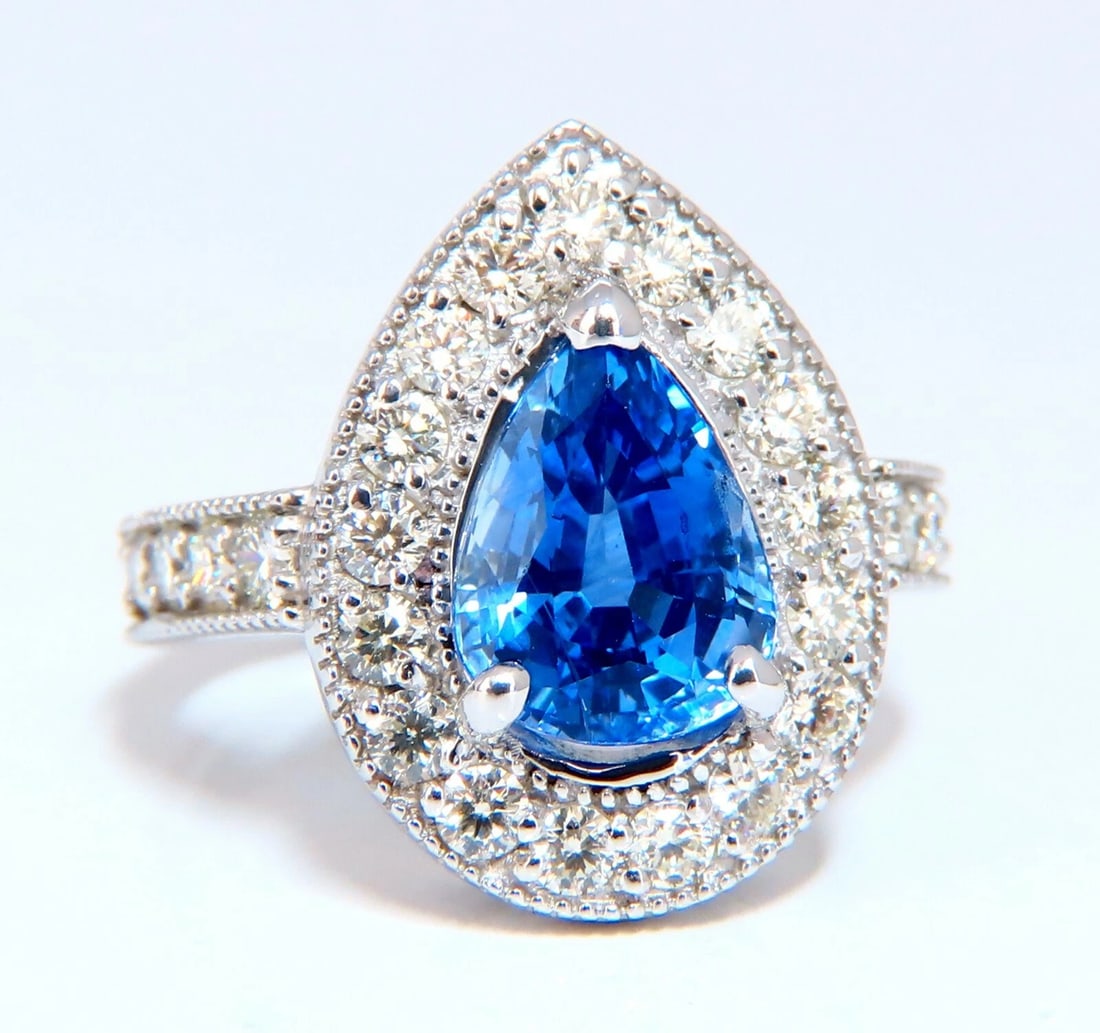 GIA Certified 3.73ct Natural Pear Sapphire Halo Cluster Ring 14 Karat: Title: GIA Certified 3.73ct Natural Pear Sapphire Halo Cluster Ring 14 Karat Description: Halo Pear Blue GIA Certified 3.73ct. Natural Sapphire ring. Report: 2195676331 (to accompany) pear cut: 10.23