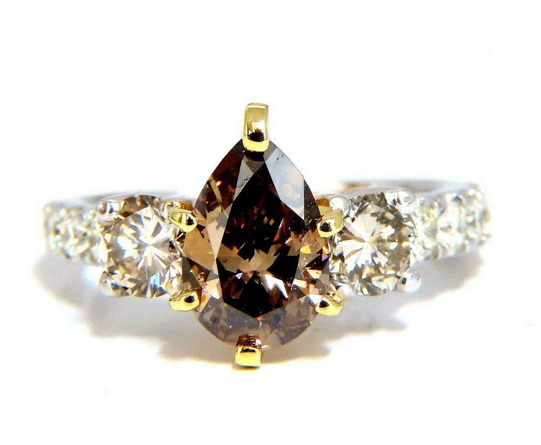 1.50ct Natural Fancy Brown & 1.30ct Diamonds Mod Three Ring 14 Karat: Title: 1.50ct Natural Fancy Brown & 1.30ct Diamonds Mod Three Ring 14 Karat Description: Classic Three & Accent. 1.30ct. Natural Pear diamond ring Fancy brown color Si-1 clarity 7.6 x 6.2mm Very good
