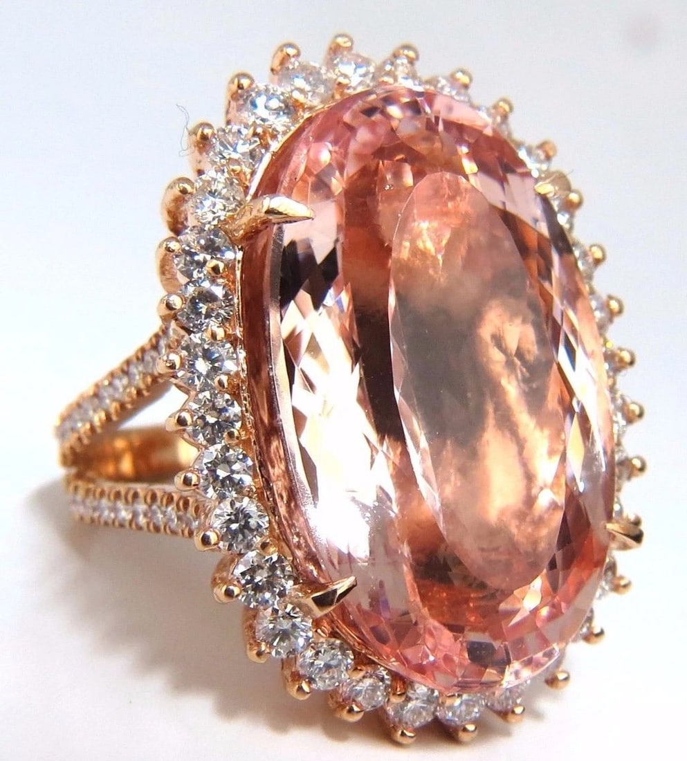 GIA Certified 36.18ct Natural Orangy Pink Morganite Diamonds Ring 18kt: Title: GIA Certified 36.18ct Natural Orangy Pink Morganite Diamonds Ring 18kt Description: Split Shank Morganite Halo 33.18ct. Natural Orangy Pink Morganite & 3.00ct. diamonds ring. GIA Certified Repo