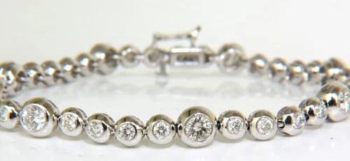 3.65CT NATURAL DIAMONDS TENNIS BRACELET 14KT FLUSH**: Title: 3.65CT NATURAL DIAMONDS TENNIS BRACELET 14KT FLUSH** Description: MAGNIFICENT JEWELS 3.65CT BEZELS DIAMOND BRACELET Diamonds: Vs-2 Si-1 clarity G-H color. full cut / max. brilliance taken close