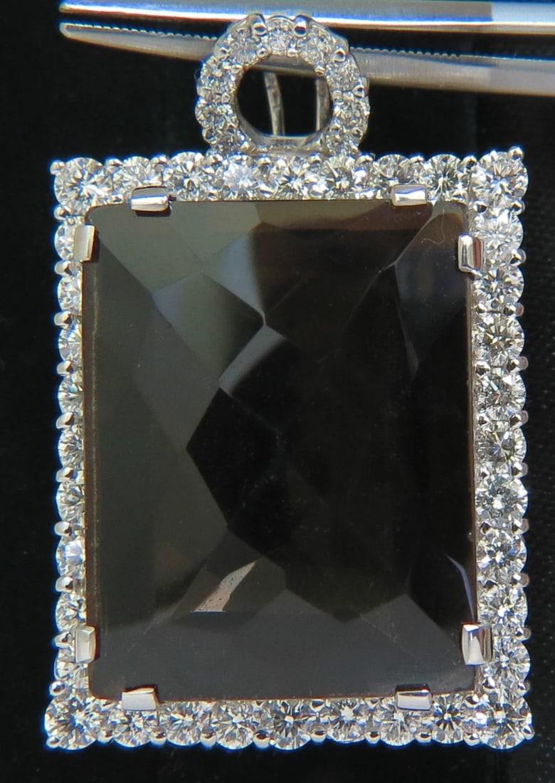 52.34CT NATURAL FANCY BROWN TOPAZ DIAMOND NECKLACE & OMEGA 14KT**: Title: 52.34CT NATURAL FANCY BROWN TOPAZ DIAMOND NECKLACE & OMEGA 14KT** Description: 48.34ct. Natural Chocolate color topaz 27.2 X 21.3mm Clean clarity Brilliant Side diamonds: 4.00ct. Rounds, full