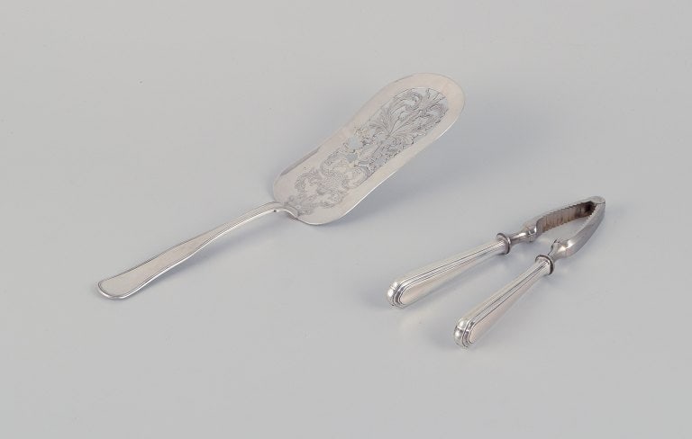 Danish silversmiths. Large "Old Danish" serving spade and "Old Danish" nutcracker in 830 silver.: Title:Danish silversmiths. Large "Old Danish" serving spade and "Old Danish" nutcracker in 830 silver.Description:Danish silversmiths. Large "Old Danish" serving spade and "Old Danish" nutcracker in