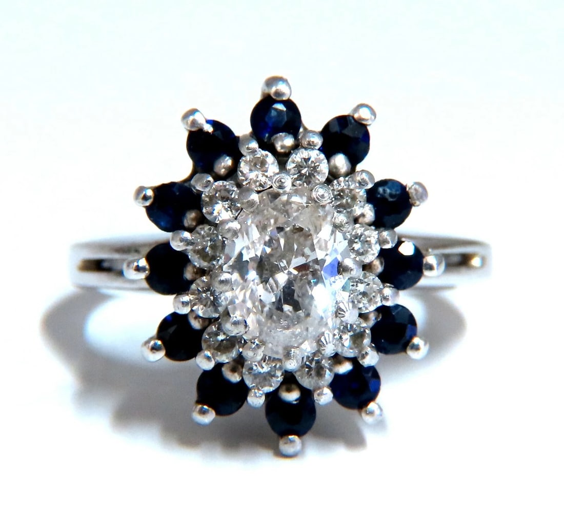 .70ct Natural Oval Diamond Sapphire Cluster Platinum Ring: Title: .70ct Natural Oval Diamond Sapphire Cluster Platinum Ring Description: Sapphire & Diamonds Cluster Ring .70ct Natural Oval Diamond Full cut and Full Faceted. I-color Si-2 clarity. .70ct