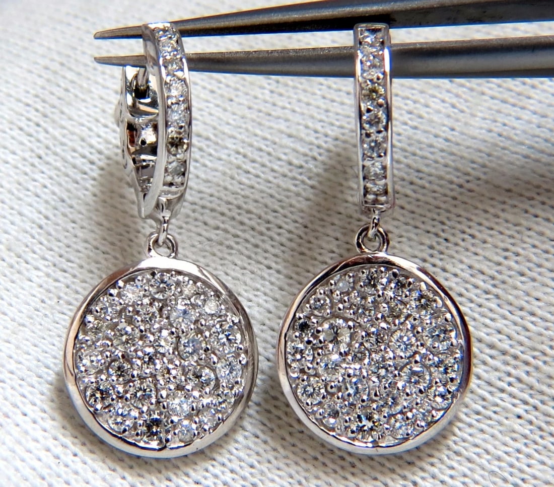 1.50ct natural diamonds dangle earrings 14kt circle dangles**: Title: 1.50ct natural diamonds dangle earrings 14kt circle dangles** Description: Circular diamond dangle earrings. 1.50cts of natural round diamonds: G-color, Vs-2 clarity. 14kt. white gold 6.3 grams
