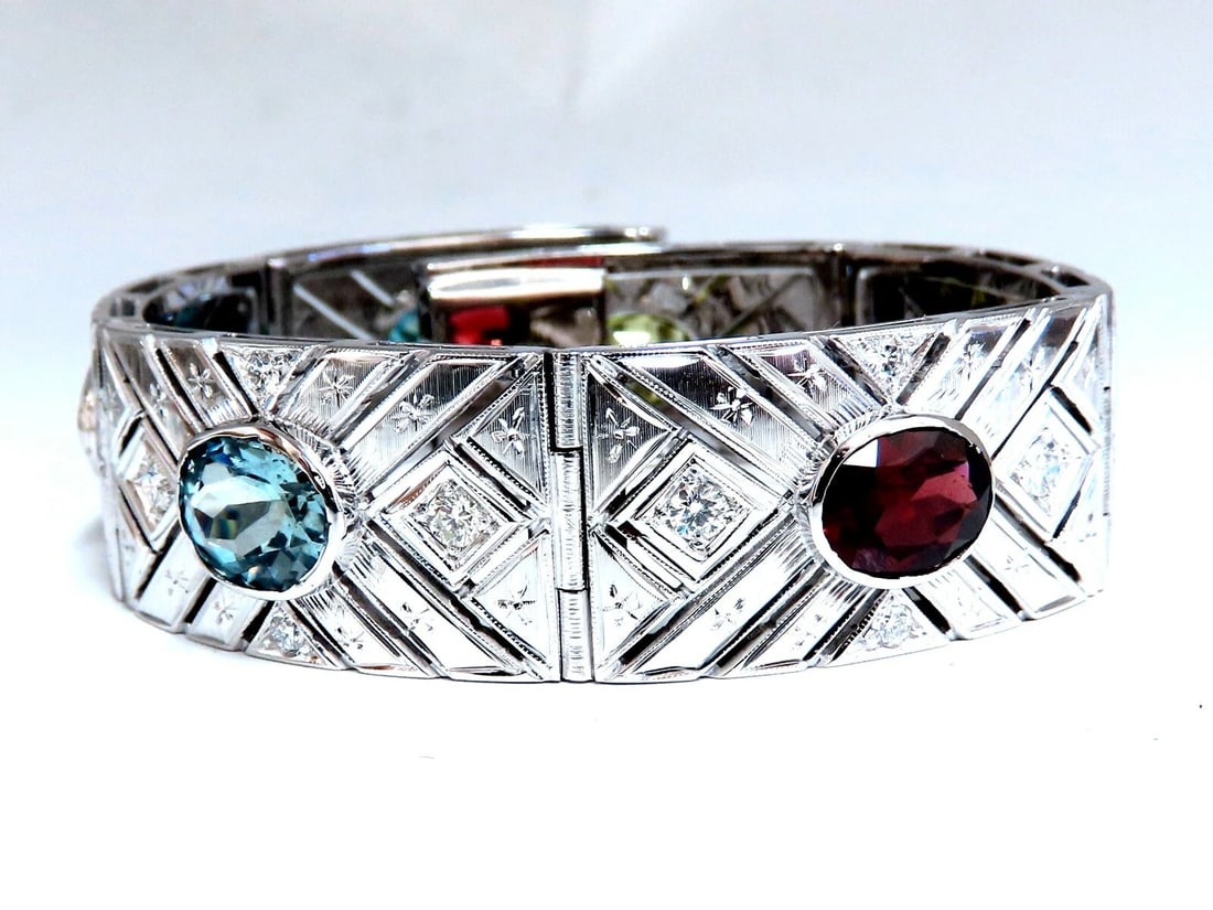 24.30ct Natural Gem Line Vintage Graver Etch Cuff Bracelet 18kt**: Title: 24.30ct Natural Gem Line Vintage Graver Etch Cuff Bracelet 18kt** Description: Calibrated Multicolor Gem-Line Cuff Bracelet. 22ct. Natural Peridot, Amethyst, Garnet, Aquamarine, Tanzanite & Blu
