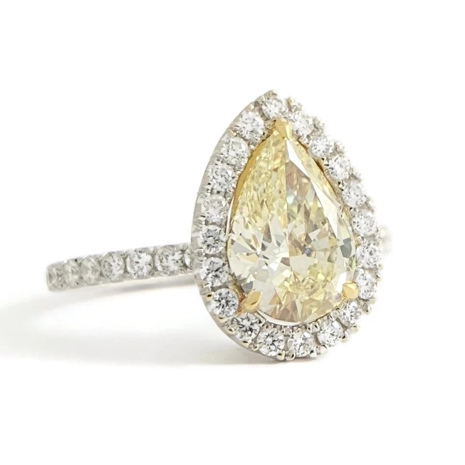 GIA Fancy Yellow Pear Diamond Halo Engagement Ring 18K White Gold, 1.72 CTW: GIA Fancy Yellow Pear Diamond Halo Engagement Ring 18K White Gold, 1.72 CTW This is a gorgeous diamond engagement ring! Please let us know if you have any questions! Diamonds: 1.72 ctw; 1 pear shape 1