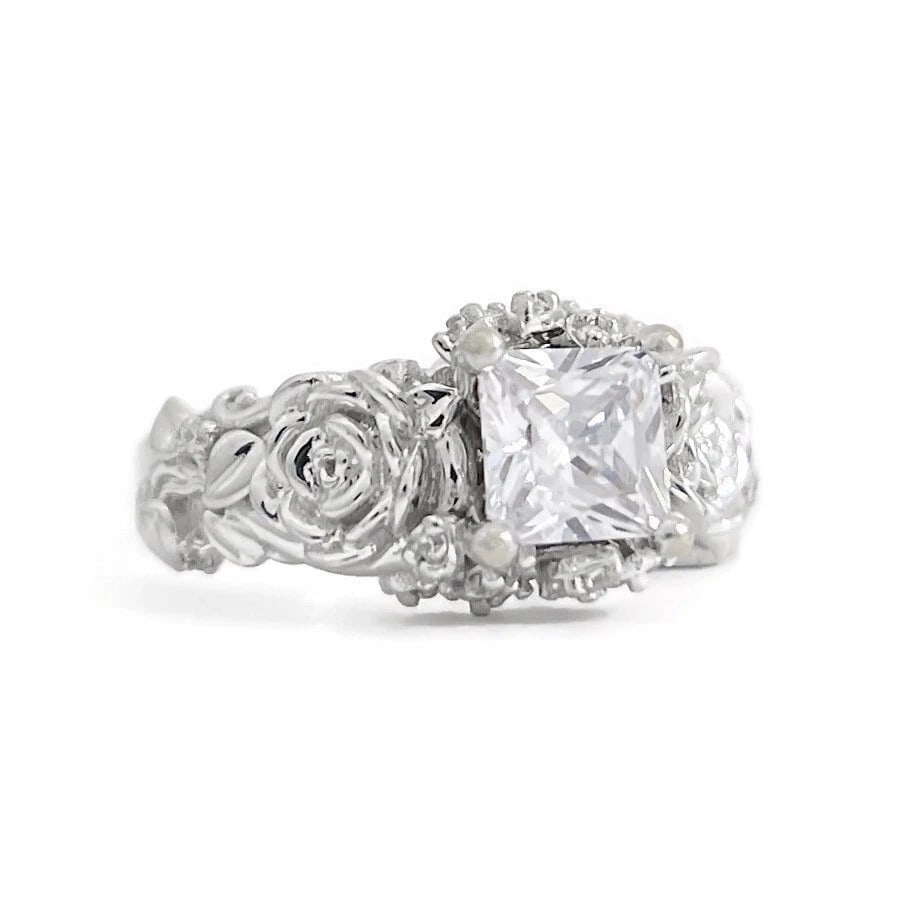 Princess Cut CZ Cubic Zirconia Flower Engagement Ring 10K White Gold, 6.67 Grams: Princess Cut CZ Cubic Zirconia Flower Engagement Ring 10K White Gold, 6.67 Grams Make a statement with this lovely ring! Please let us know if you have any questions. Gemstone: .95 ctw; 1 princess cut