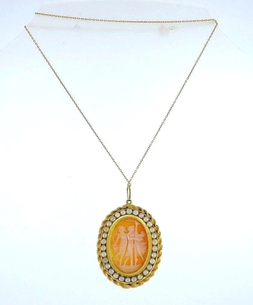 Yellow Gold Pearl Cameo Necklace: Title: Yellow Gold Pearl Cameo NecklaceDescription: Vintage yellow gold pearl cameo necklace The chain is 18k gold (stamped), the cameo is 14k gold (stamped) Measurements: the chain is 19.5" long,