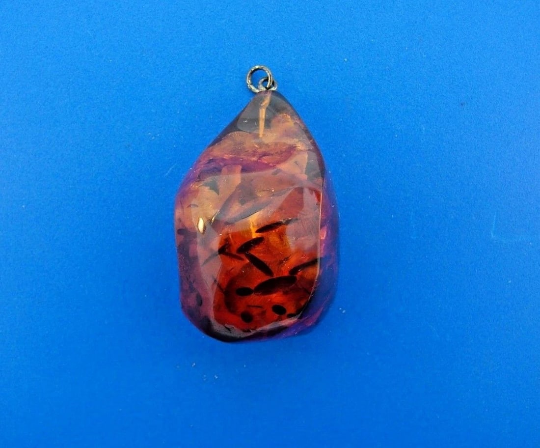 GORGEOUS Amber Pendant: Title: GORGEOUS Amber Pendant Description: Amber Pendant · This is a must for any collector. · The weight is 16.2 grams. · The height with bail is 2 inches. The length is 1 1/8 inches.