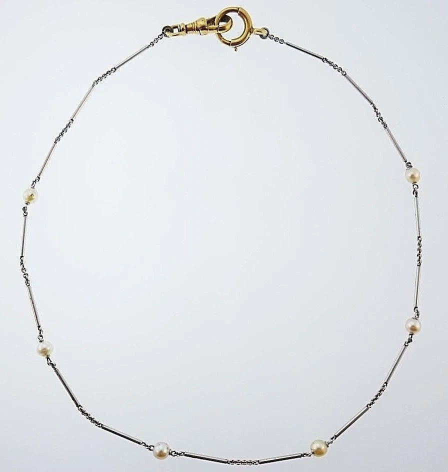Platinum Pearl Watch Chain with 14k Yellow Gold Clasp: Title: Platinum Pearl Watch Chain with 14k Yellow Gold ClaspDescription: Classy Platinum Pearl Watch Chain features 14k Yellow Gold Lobster Clasp Pearls are naturals Measurements: Length is 16 inches