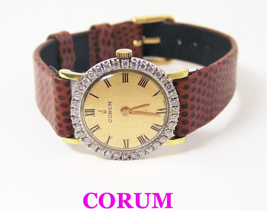 Solid 18k CORUM Ladies Watch 27307 with 1ct Diamonds FVS1* EXLNT* SERVICED: Solid 18k CORUM Ladies Watch 27307 with 1ct Diamonds FVS1* EXLNT* SERVICED​ This Ladies CORUM watch is Swiss made. Great present for yourself or someone you love! * Solid 18k yellow gold