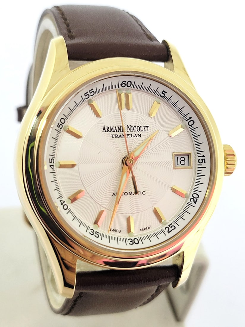 Men's Solid 18k ARMAND NICOLET Tramelan Automatic Date Watch* EXLNT: Men's Solid 18k ARMAND NICOLET Tramelan Automatic Date Watch* EXLNT This Men's ARMAND NICOLET watch is Swiss made. Great present for yourself or someone you love as well as for vintage collectors