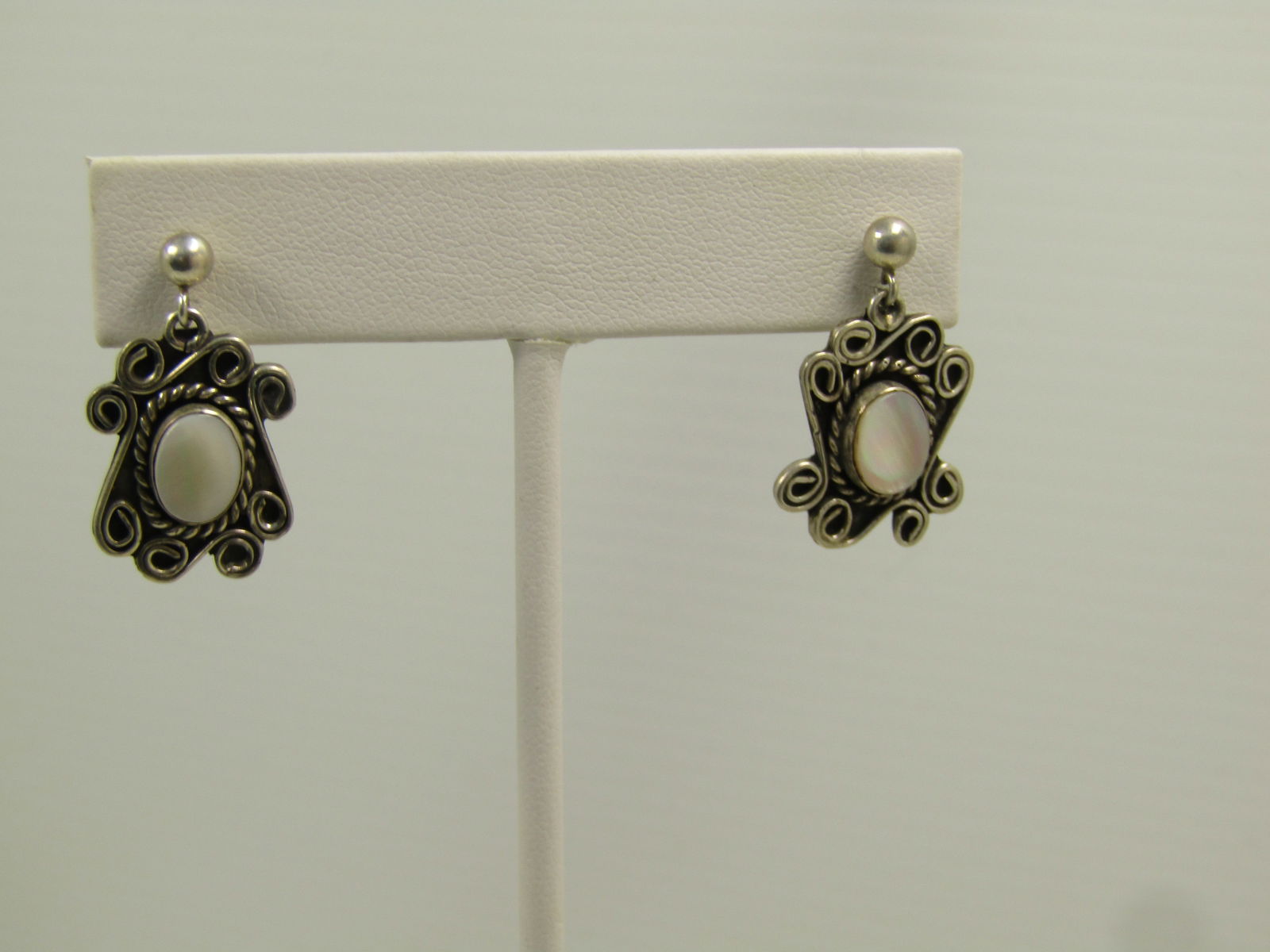Vintage Sterling Mother-of-Pearl Earrings, Shadowbox, Pierced, 1970's, 1980's: Vintage Sterling Mother-of-Pearl Earrings, Shadowbox, Pierced, 1970's, 1980's. Signed D.F. These have an appx. 3.5mm round ball stud with a scrolled dangle with recessed back with raised oval