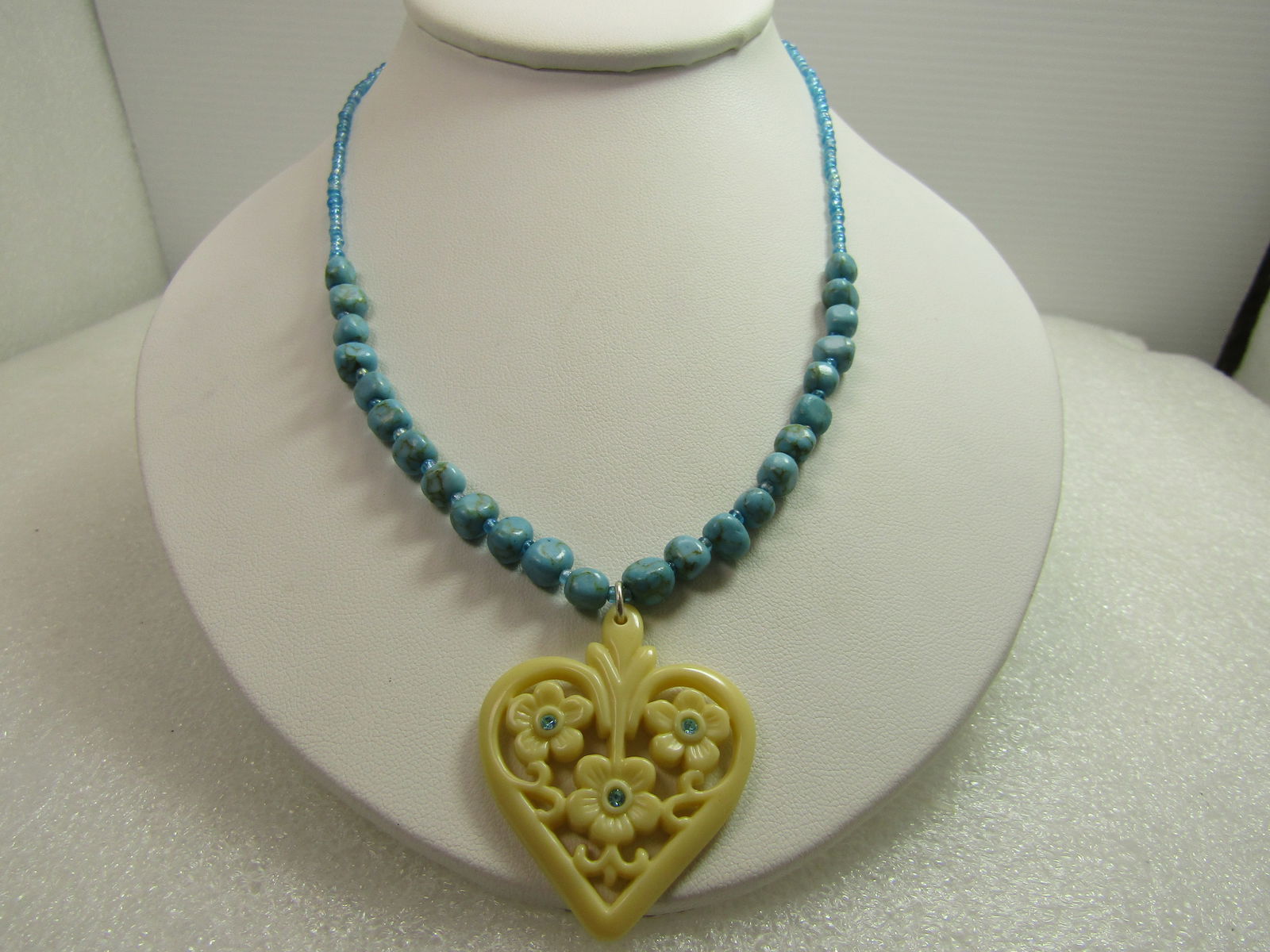 Vintage Faux Turquoise White Heart Necklace/Blue Rhinestones, Signed Avon, 1980's-1990's, 16"-19": Vintage Faux Turquoise White Heart Necklace/Blue Rhinestones, Signed Avon, 1980's-1990's, 16"-19". This necklace has turquoise glass seed beads with faux turquoise irregular shaped nugget type beads t