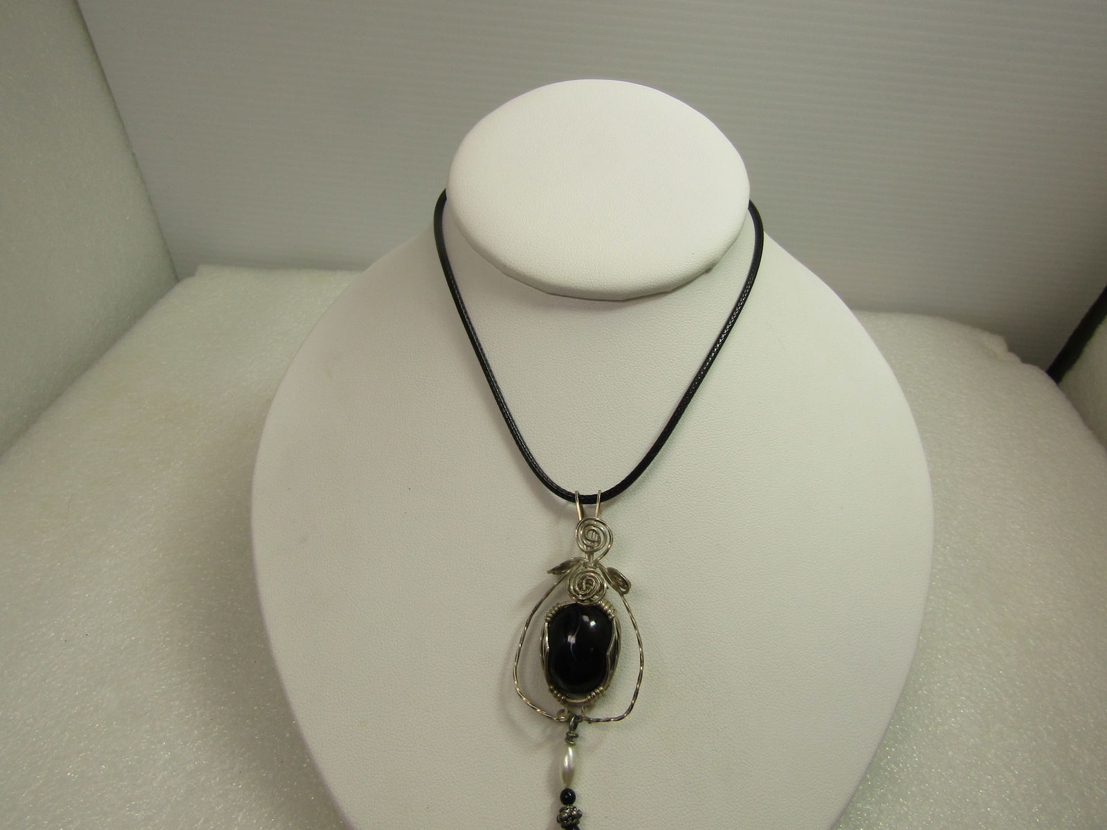 Vintage Sterling Wire Wrapped Black Glass Pendant/Necklace, 18"-20", 1980's-1990's: Vintage Sterling Wire Wrapped Black Glass Pendant/Necklace, 18"-20", 1980's-1990's. THis is a black stone that is believed to be glass, oval and highly domed with muted swirls. The stone is appx. 18mm