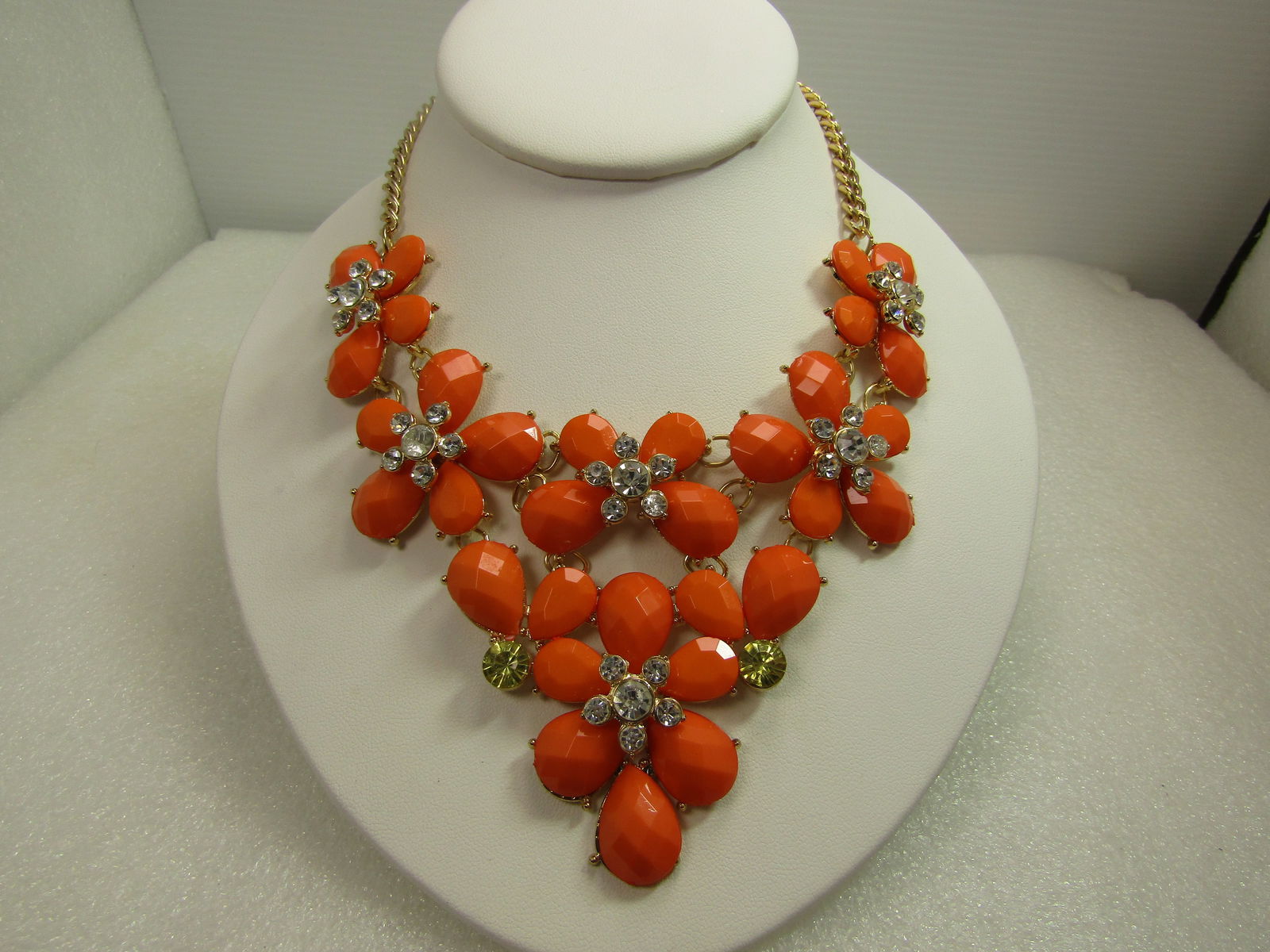 Orange & Clear and Blue Rhinestone V-Drop Bib Necklace, 21", Gold Tone, 1980's-2000's: Orange & Clear/Blue Rhinestone V-Drop Bib Necklace, 21", Gold Tone, 1980's-2000's. Quite the statement necklace with four orange lucite honeycomb faceted tear-drop cabochones set in a blossom shape
