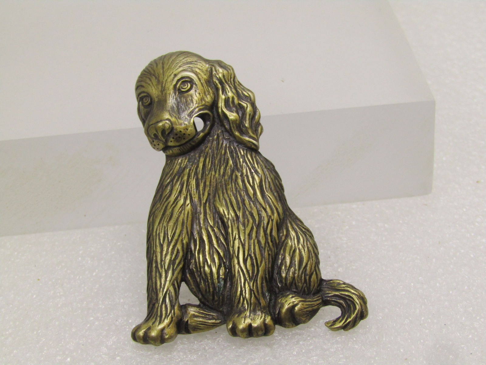 Vintage Retriever Dog Brooch, Signed J.J, 1970's-1980's: Vintage Retriever Dog Brooch, Signed J.J, 1970's-1980's. The dog is sitting up and a brassy gold tone with furry detail. This may have had a bone or newspaper or something through his mouth as it has