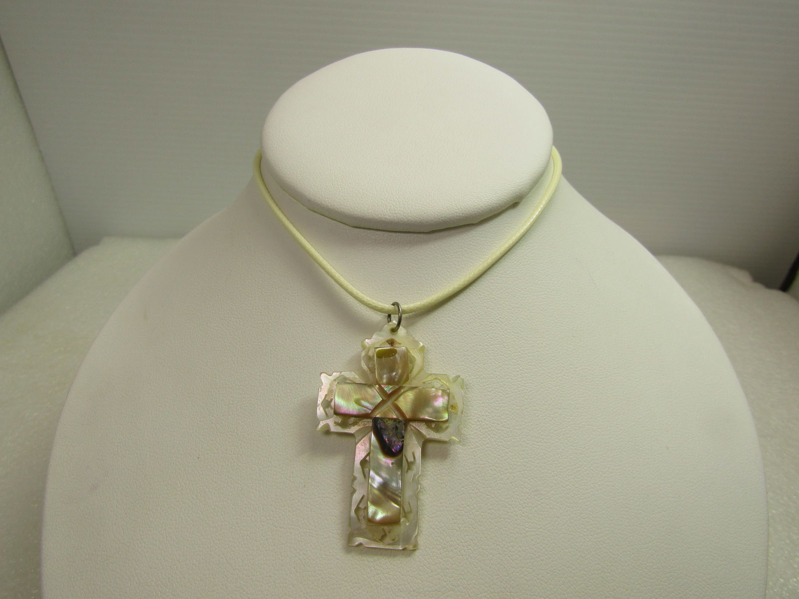 Vintage Carved Mother-of-Pearl Cross Necklace, 18"-20", 1960's, Signed: Vintage Carved Mother-of-Pearl Cross Necklace, 18"-20", 1960's, Signed with what starts with a B - could be Bethlehem which is common but the letters don ot seen to be Bethle but ends in hem so