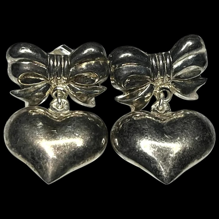Vintage Sterling Silver Bow and Puffy Heart Statement Earrings: Title: Vintage Sterling Silver Bow and Puffy Heart Statement Earrings Description: Vintage Sterling Silver Bow and Puffy Heart Statement EarringsHallmarked 925 Weighs 4.7 gramsMeasures Approx. 1 inch
