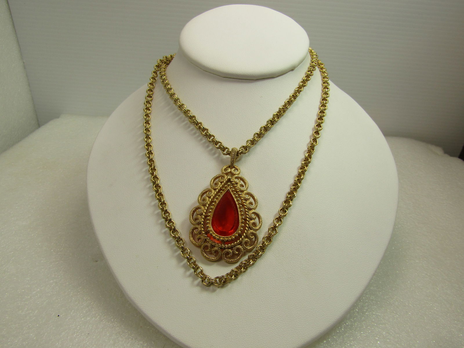 Vintage Orange Glass Pendant, Double/Single Strand Necklace, Signed Avon, 1960's-1970's: Vintage Orange Glass Pendant, Double/Single Strand Necklace, 1960's-1970's - 40" or 16" & 20" if worn as a double strand. It has an oval link to convert it from a long necklace to a double strand neck