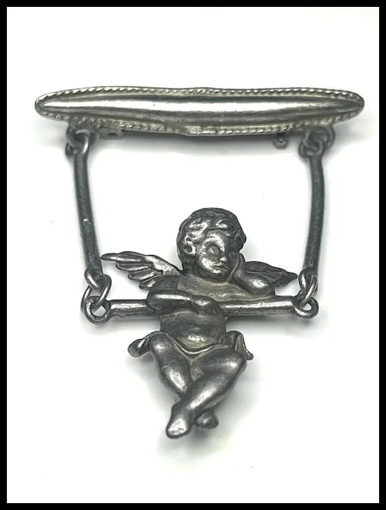 Vintage Articulated Swinging Cherub Brooch: Title: Vintage Articulated Swinging Cherub Brooch Description: Vintage Articulated Swinging Cherub BroochHallmarked: JJWeighs: 14 grams Measures: Approx 2.50 x 1.75 inches Reserve: $15.00 