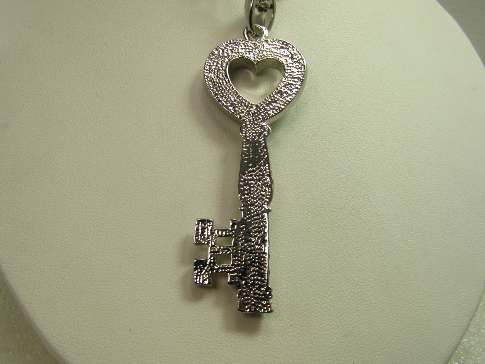Vintage Clear Rhinestone Heart Key Necklace,, 18"-22", 1980's-1990's: Vintage Clear Rhinestone Heart Key Necklace,, 18"-22", 1980's-1990's . The key pendant is appx. 3.25" tall with the bail and papx. 1-1/8" wide at the heart topper to the key. Silver tone pendant
