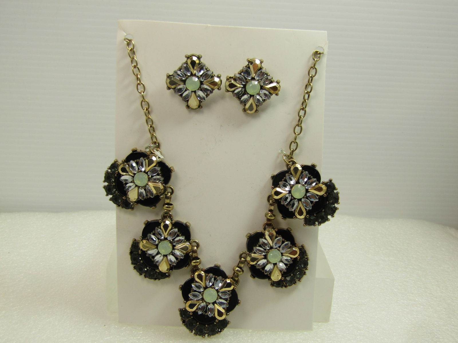 Yellow/Gold/Black Rhinestone Drop Necklace and Earrings, 18"-21", 1980's-1990's: Yellow/Gold/Black Rhinestone Drop Necklace and Earrings Set, pierced. 18"-21", 1980's-1990's. This has a g old tone chain with a drop in the front with five links thate have a black smooth background