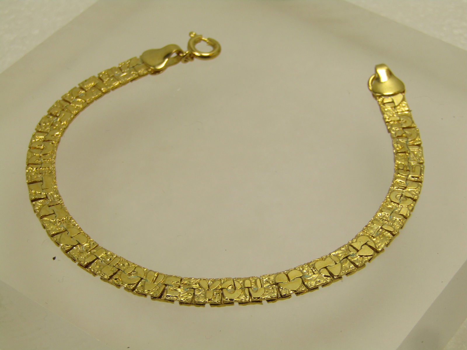 Vintage I Love You Nugget Bracelet , 7.5", Reversible, Gold Tone, 1970's-1980's: Vintage I Love You Nugget Bracelet , 7.5", Reversible, Gold Tone, 1970's-1980's. This is a flat bracelet with the nugget look on one side with hearts and I Love You in letters over the nuggets and