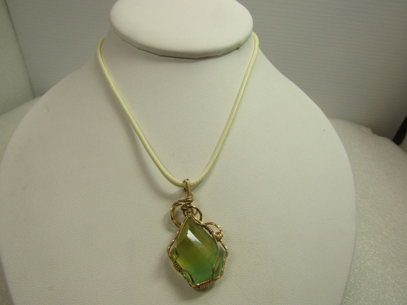 10Kt G.F. Wrapped Green/Yellow Natural Stone, Necklace, 18"-20", 1980's-1990's: 10Kt G.F. Wrapped Green/Yellow Natural Stone, Necklace, 18"-20". This has a yellow/green natural stone pendant that is wrapped in quare 10kt G.F. wire. Likely made by a person that makes jewelry as