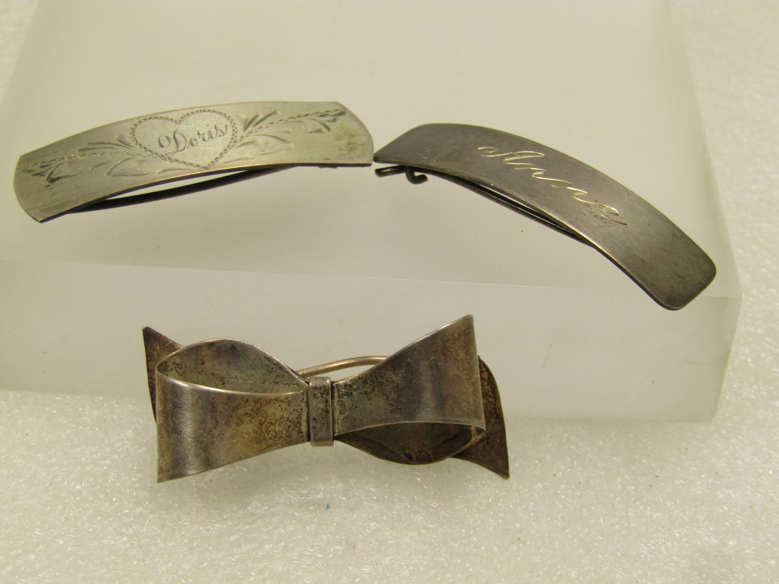 Vintage Sterling Silver Barrettes , Marked Sterling, Some Signed. 1930's: Vintage Sterling Silver Barrettes , Marked Sterling, Some Signed. 1930's, 24.45 GR. One is engravved Anne in script, it is marked sterling and is appx. 2" by 1/2". The other is a bow 3-D design and ma
