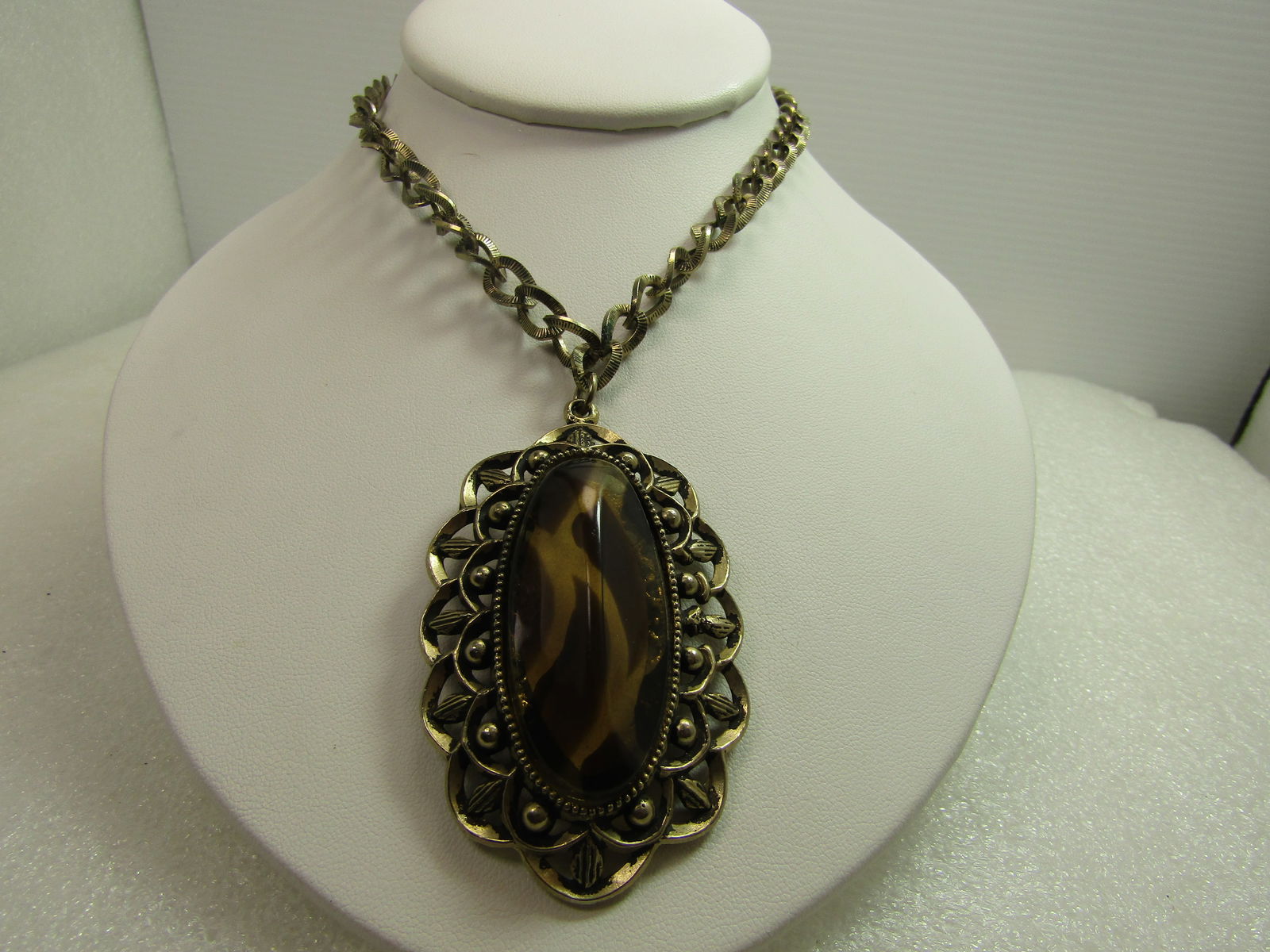 Red Acrylic Rhinestone Tassel Necklace, 34"-26", 1980's: Red Acrylic Rhinestone Tassel Necklace, 34"-26", 1980's. This has a round mesh chain that is appx.3mm wide. The pendant and tassel is appx. 5". Red rhinestones around the pear-shaped frame with a