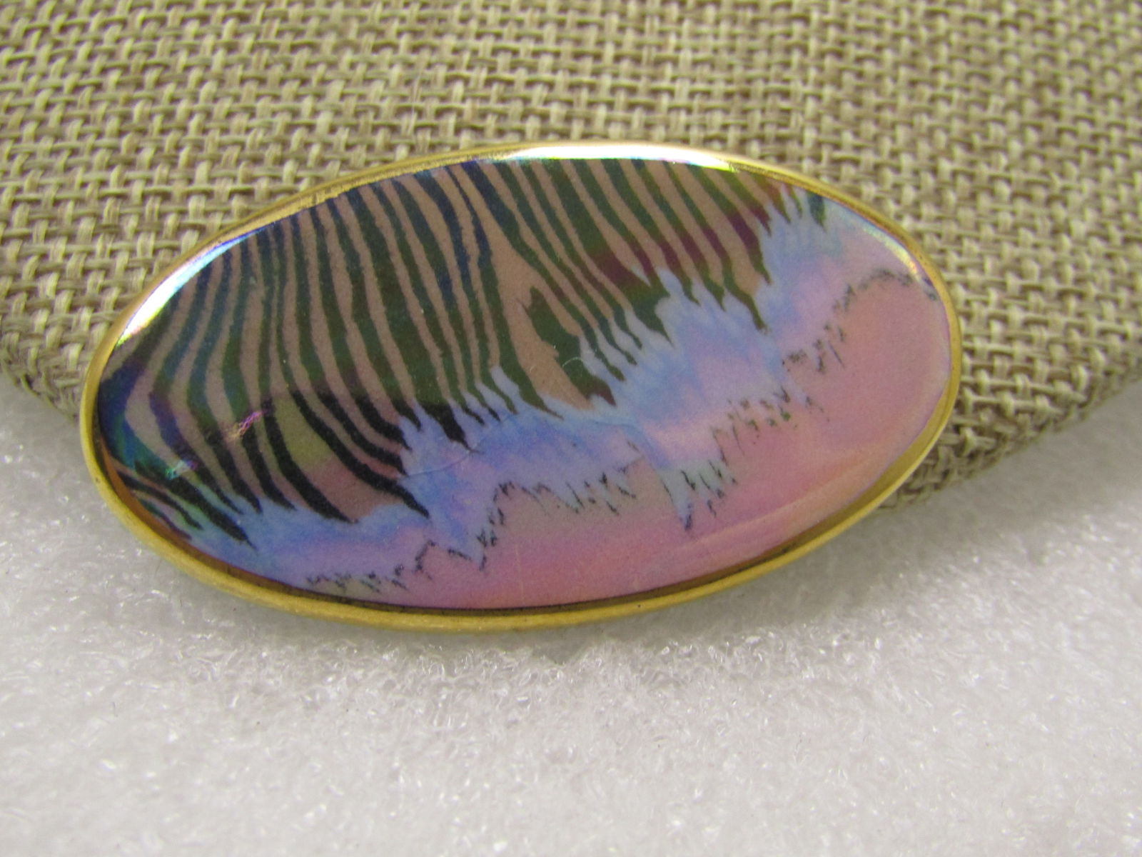 Vintage Iridescent Brooch, Tiger Stripes, Gold Trimmed, 1970's-1980's: Vintage Iridescent Brooch, Tiger Stripes, Gold Trimmed, 1970's-1980's. This has a gold trimmed design - oval - with orange background on half of it with black tiger-like stripes and on the bottom