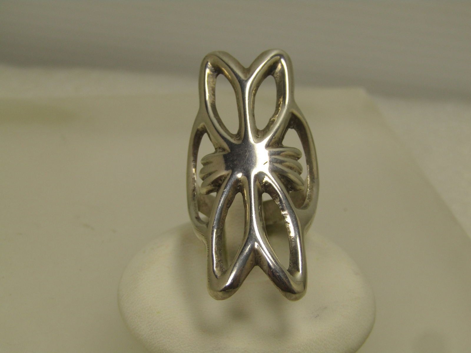 Vintage Sterling Sandcast Southwestern Ring, Sz. 7.25, 1970's-1980's, Unisex: Vintage Sterling Sandcast Southwestern Ring, Sz. 7.25, 1970's-1980's, Unisex. This is a long ring at appx. 1-5/8" and wraps around the top of the finger. The band at back is rounded and appx. 4mm.