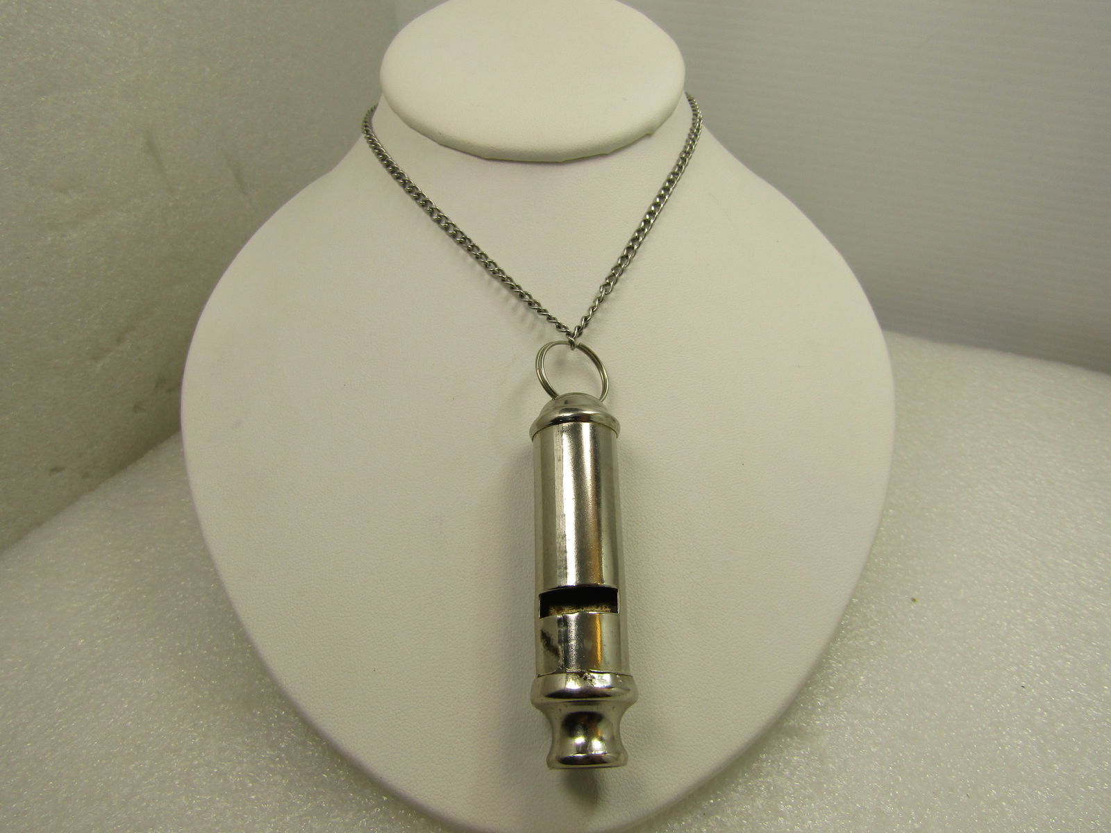 Vintage Silver Tone Long Whistle Necklace, 24", 1980's-1990's: Vintage Silver Tone Long Whistle Necklace, 24", 1980's-1990's. The whistle is 3" with the bail. The chain is a 24" silver tone curb link, slipover that is appx. 3.5mm wide. It is not signed or marked.