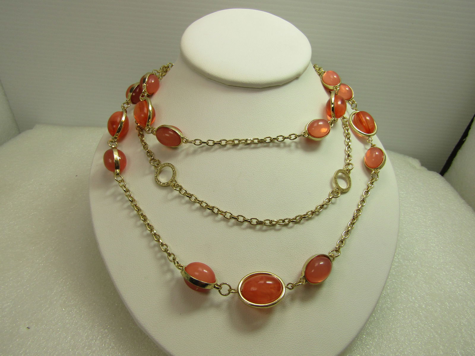 Pink Opaque & Clear/White Beaded Necklace, 24", 1980's-1990's: Pink Opaque & Clear/White Beaded Necklace, 24", 1980's-1990's. These have oval beads that are acrylic and have a gold tone equator around each stone - the largest ones spin inside the gold frame. Ther