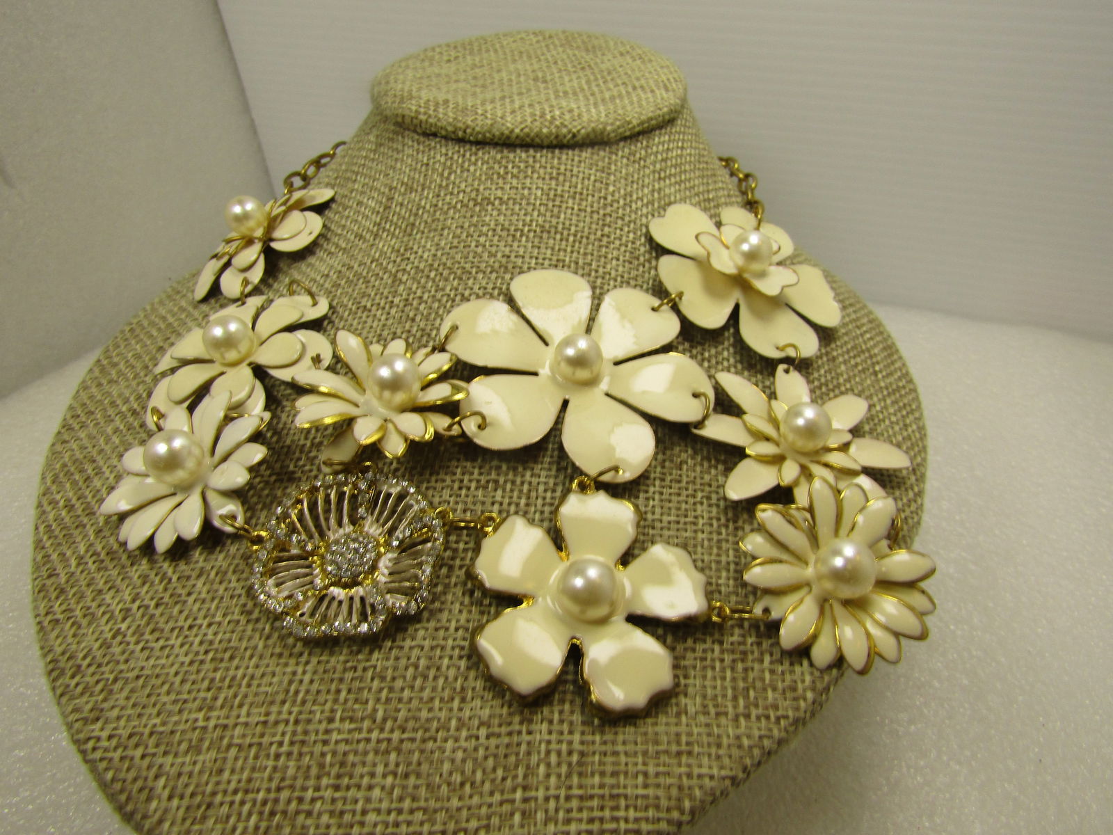 Vintage Whtie Floral Enameled Bib Necklace, Faux Pearls & Rhinestones, 1980's-1990's26"-28": Vintage Whtie Floral Enameled Bib Necklace, Faux Pearls & Rhinestones, 26"-28". 1980's-1990's. This is slightly off white in shade with a mix of daily like blossoms - some with no tiers, some with mul