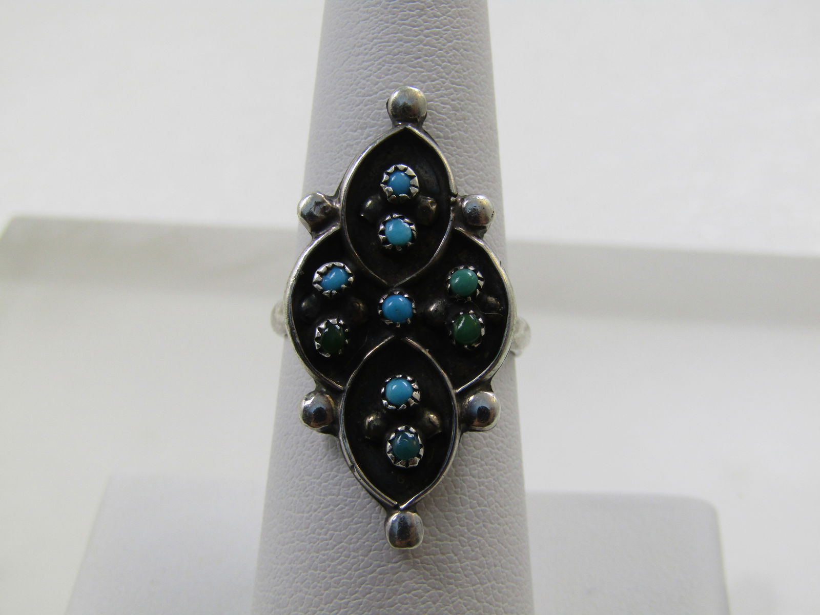 Vintage Sterling Snake Eyes Turquoise Ring, Sz. 7, 1960's-1970's: Vintage Sterling Snake Eyes Turquoise Ring, Sz. 7, 1960's-1970's, Shadowbox design long ring with bead accents at the curved intersections and points. The ring is appx. 1.25" long and .75" wide. 
