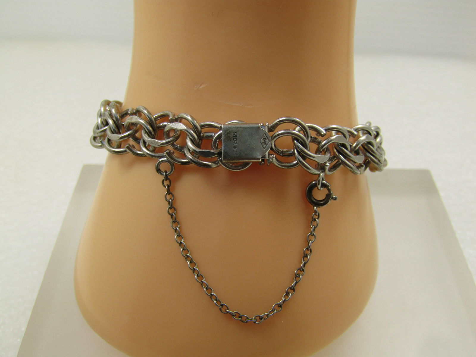 Vintage Sterling Double Link Charm Bracelet, 6.75", Safety Clasp, Signed JMS, 1940's-1960's: Vintage Sterling Double Link Charm Bracelet, 6.75", Safety Clasp, Signed JMS, 1940's-1960's. This is appx. 10mm wide with wide box clasp and a safety chain. The links have flat and rounded design. Wei