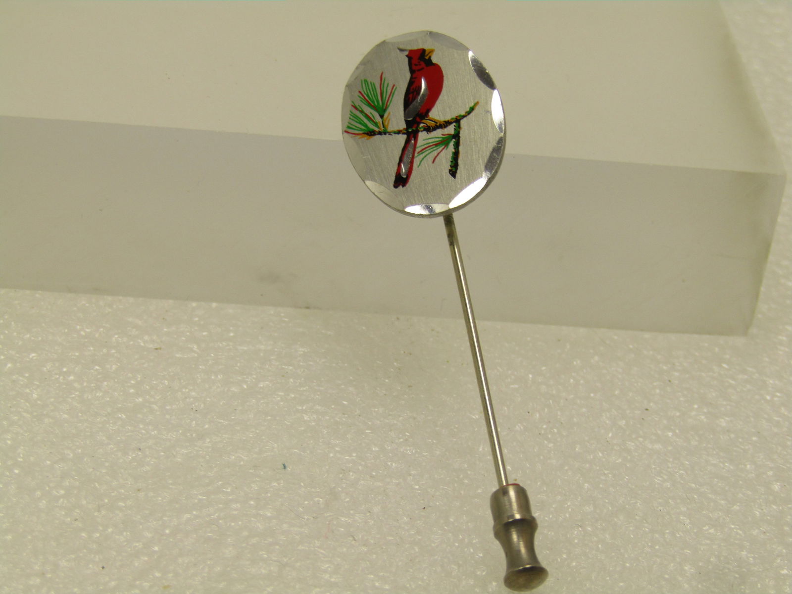 Vintage Blackinton Pewter Cardinal Stick Pin, 1980's: Vintage Blackinton Pewter Cardinal Stick Pin, 1980's. Petwer top with an enameled red cardina on a pine brach with green and red needles. The topper has notched curved edge and is appx. 1" by 3/4". Th