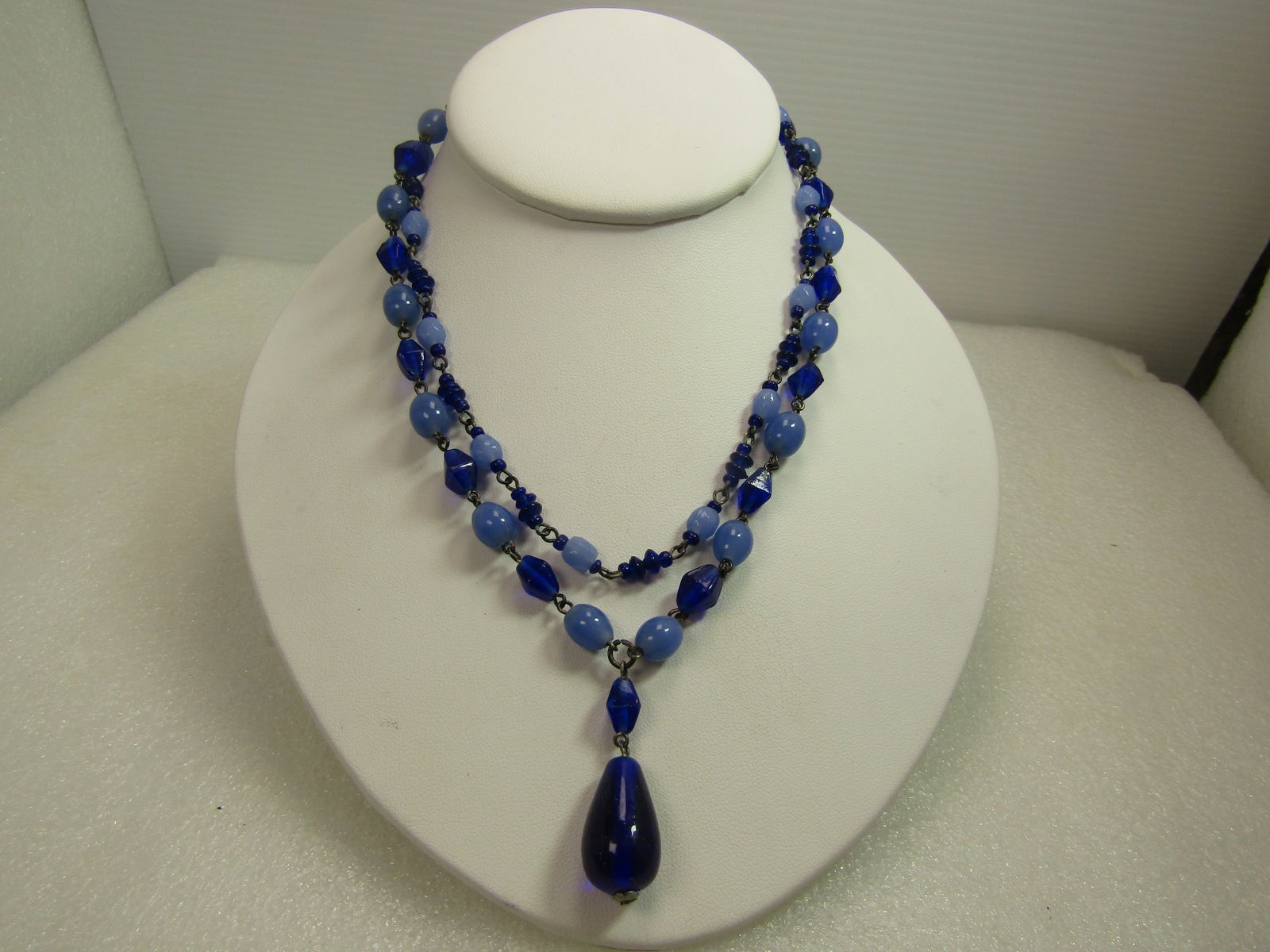 Vintage Black Glass/Metal Leave Brooch & Clip Earrings, 1940's-1950's: Vintage Black Glass/Metal Leave Brooch & Clip Earrings, 1940's-1950's. The brooch has two leaves - domed in the center with pionted edges and curved stem. Black enameled metal. Locking Clasp. It is ap