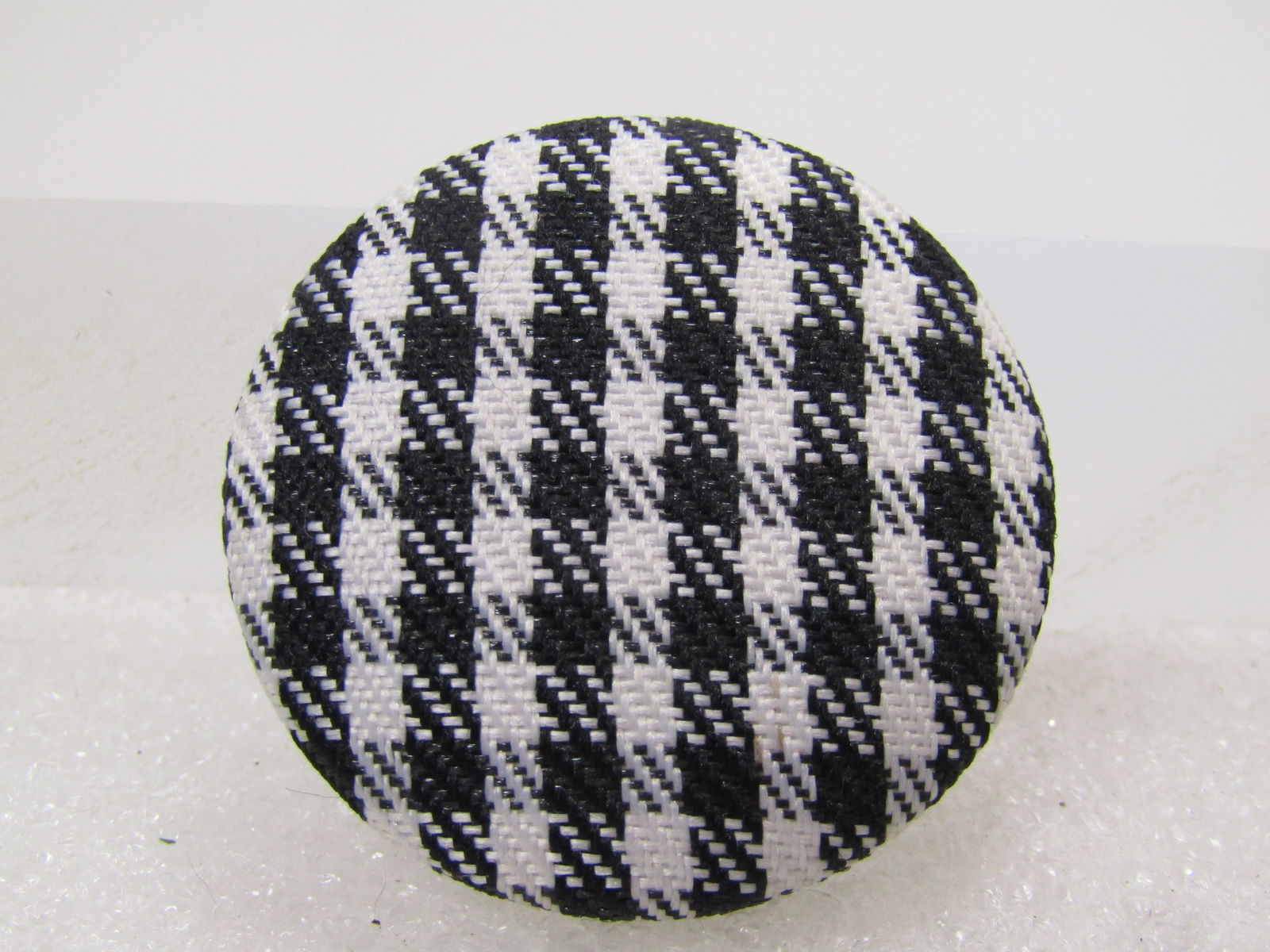 Vintage Black & White Plaid Fabric Brooch, 1970's-1980's: Vintage Black & White Plaid Fabric Brooch, 1970's-1980's. This is appx. 1.5". Silver tone back with glued on pinback. It is not signed or marked - very clean and in excellent condition. (NY5.2