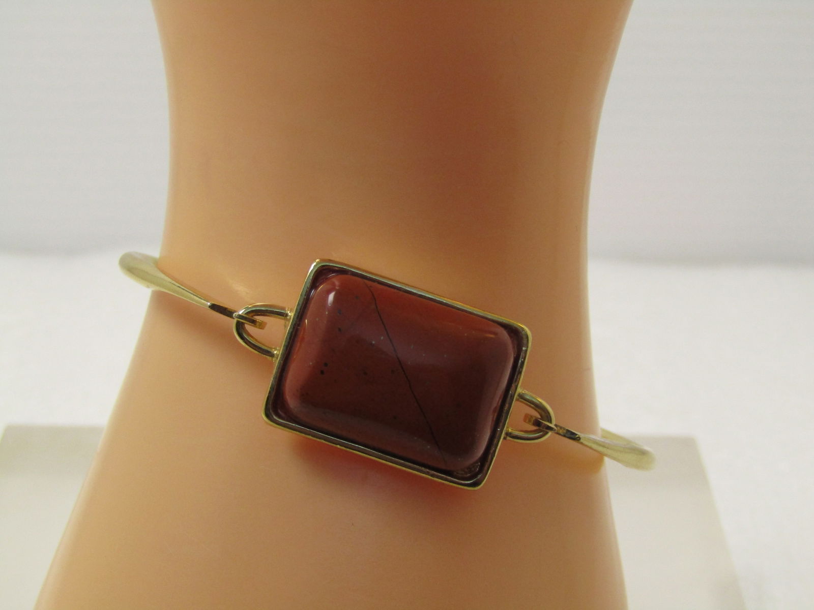 Vintage Red Jasper Bangle Bracelet, Signed Roman, Top Lock, 1980's, 6.75": Vintage Red Jasper Bangle Bracelet, Signed Roman, Top Lock, 1980's, 6.75" Gold Tone and signed Roman on the back. There are two taps on the side of the setting of the jasper stone that hook on to the