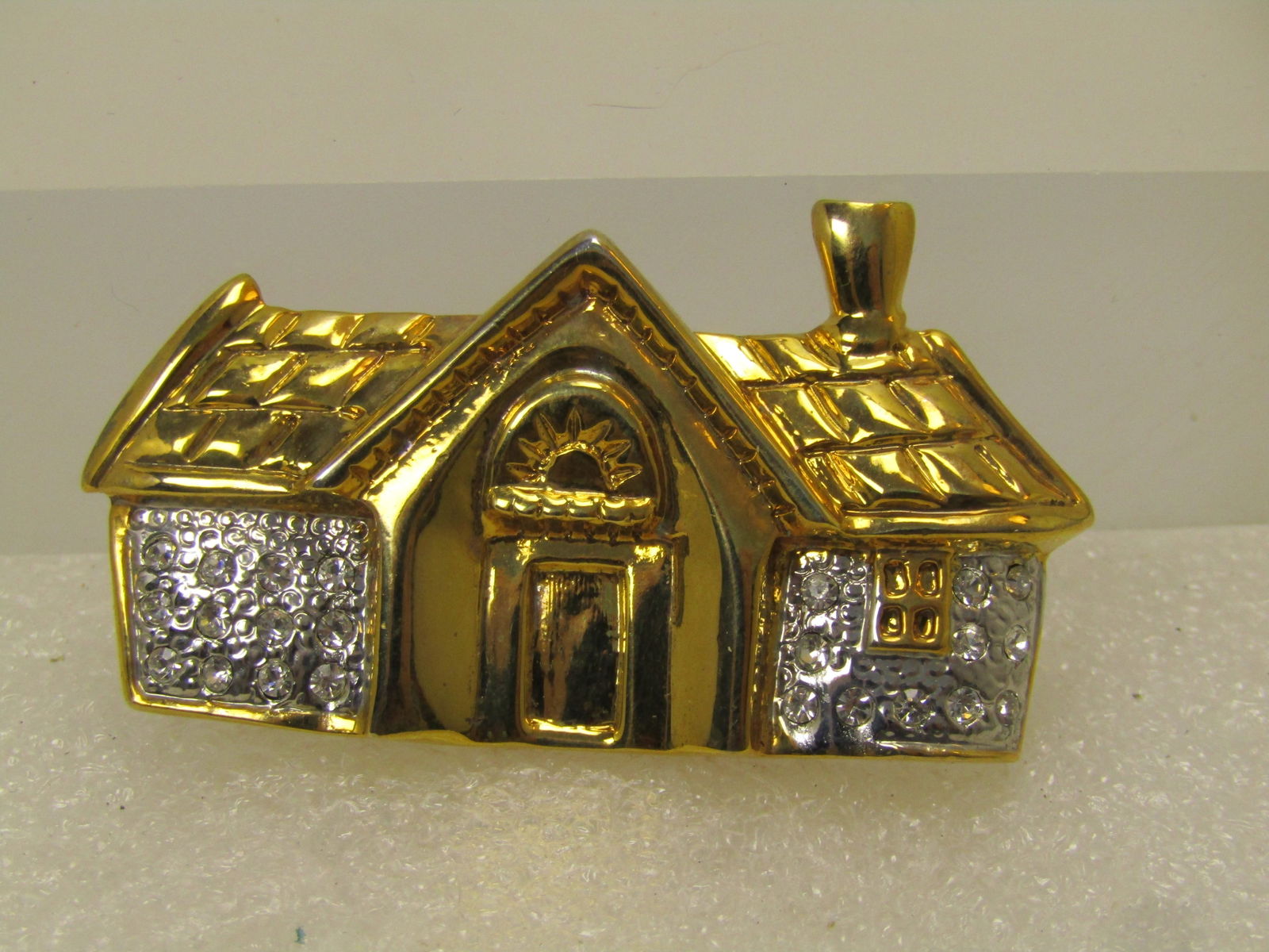 Vintage Two-Tone House Brooch, with Rhinestones, 1980's-1990's: Vintage Two-Tone House Brooch, with Rhinestones, 1980's-1990's. The brooch is gold tone front and roof and window and silver tone with rhinestones left and right. It is appx. 2" wide and slightly